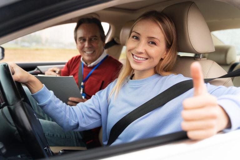 woman-male-driving-instructor-during-driving-test